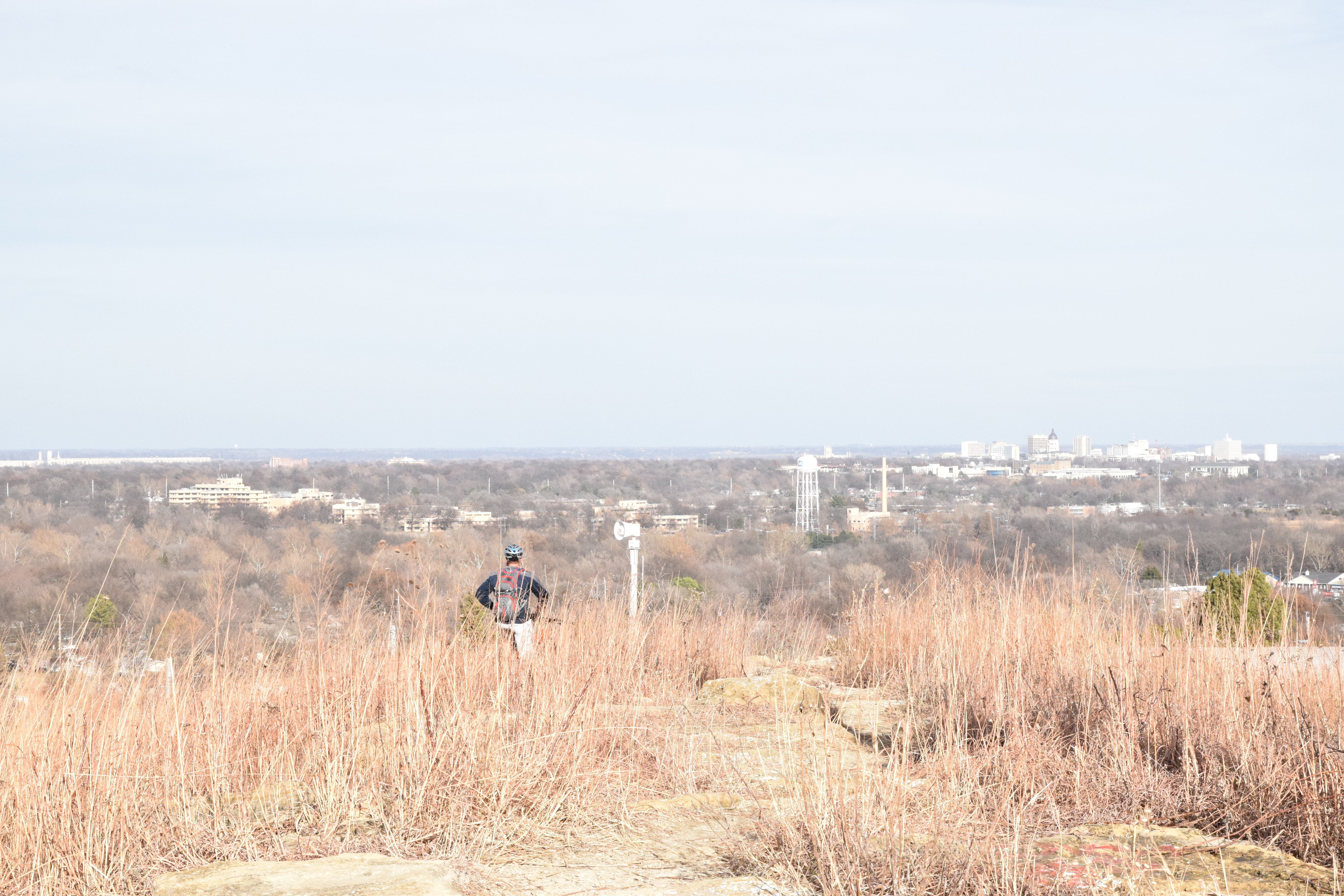 Mountain bikers takes in view from the top